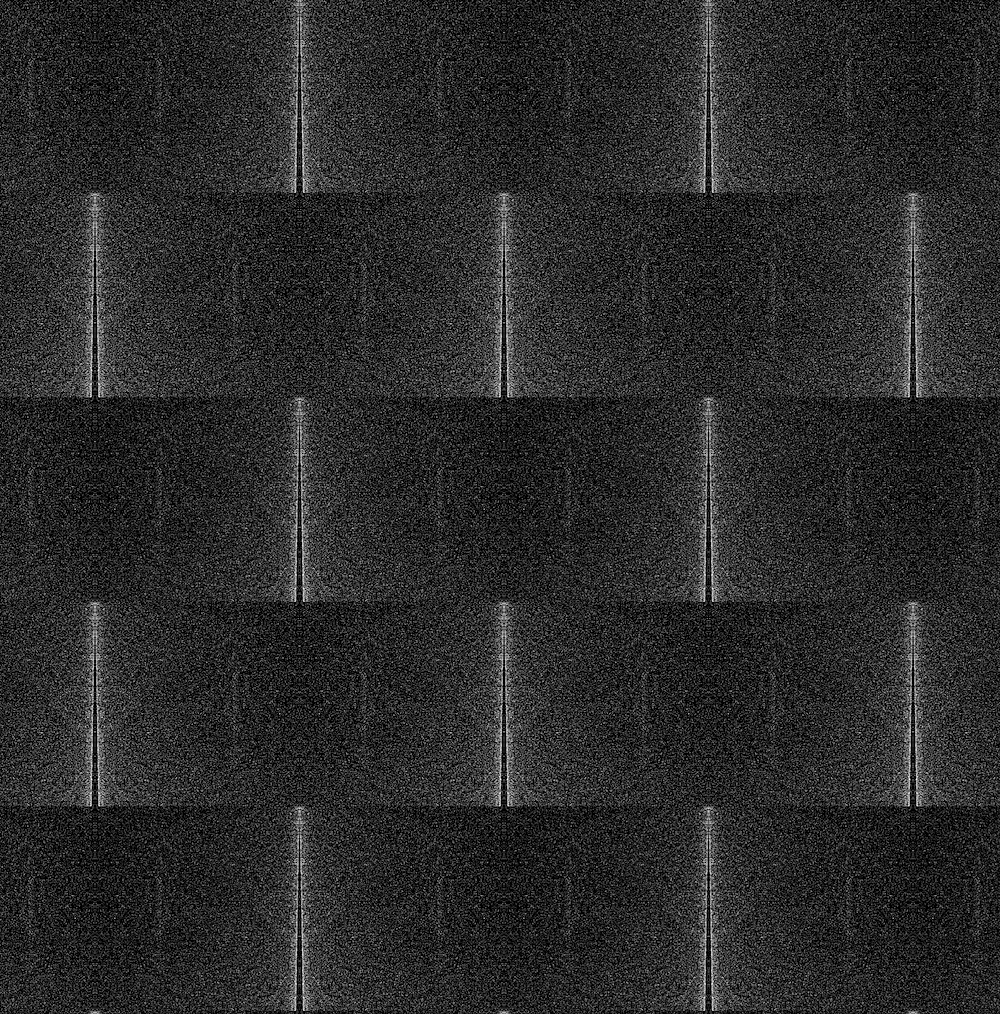 A digital pattern composed of grainy greyscale rectangles tiled in rows. The density of digital noise is concentrated at the centre of each rectangle and diffuses towards the edges, creating an illusory beveled effect. 
