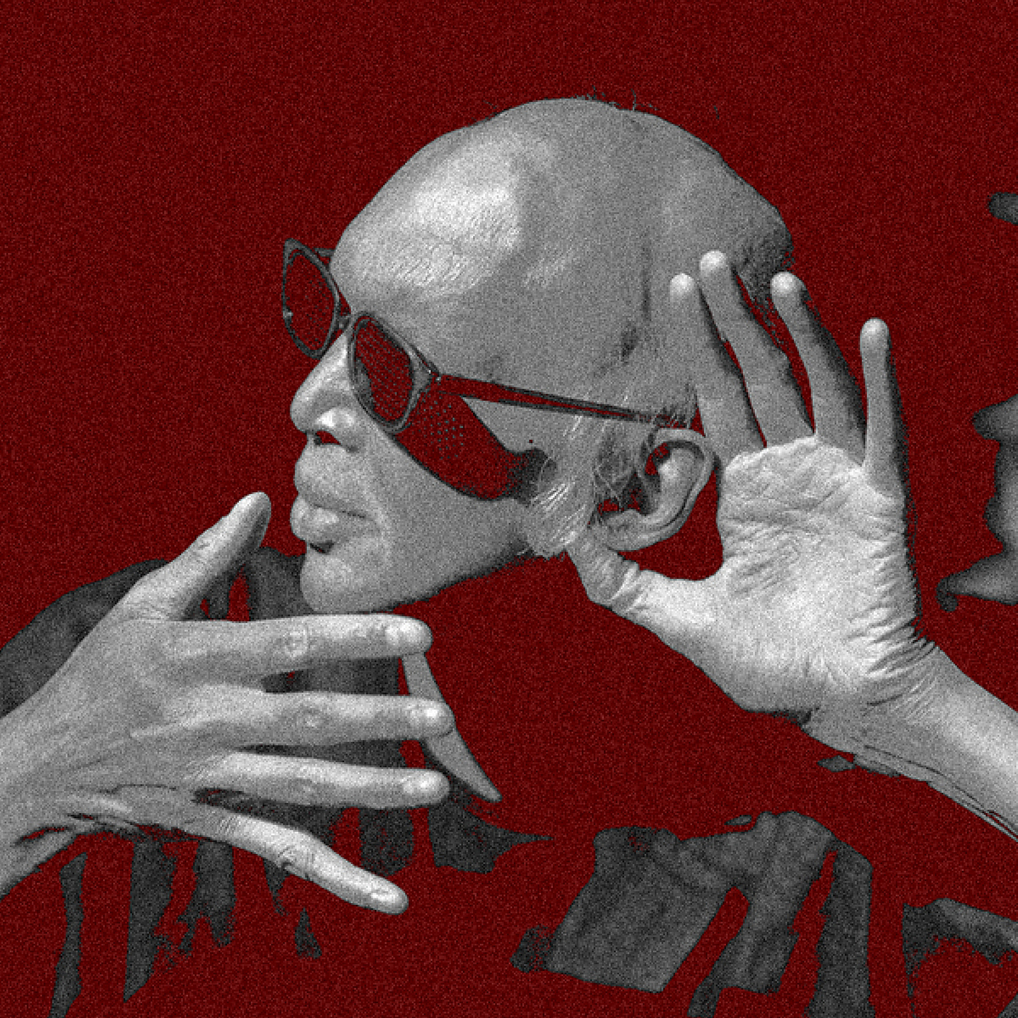 A solarized black and white photo of Shahzad Ismaily wearing sunglasses, while looking over his right shoulder and raising his left had to his ear.